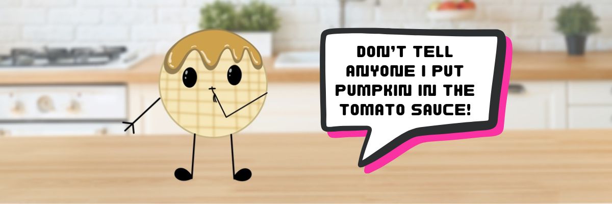 A waffle cartoon character on a counter with a word bubble saying "Don't Tell Anyone I Put the Pumpkin In the Tomato Sauce".